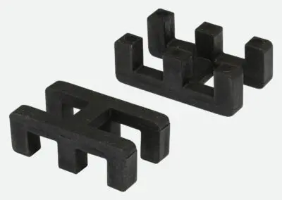 A close up of black connector clips for the GoldCut Flex Safety Mat