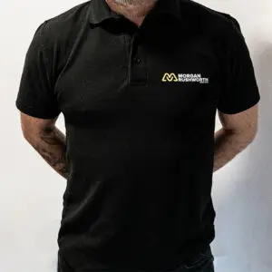A close up of a black Morgan Rushworth Polo Shirt