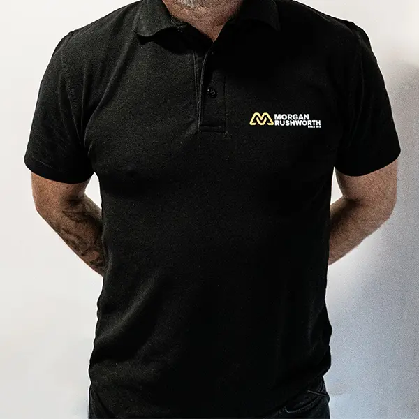 A close up of a black Morgan Rushworth Polo Shirt